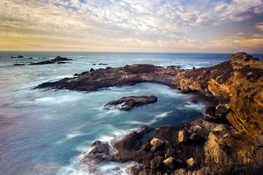 Golden sunset light illuminates Point Lobos State Natural Reserve just south of Carmel-by-the-Sea, CA.