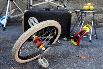 Fototapeta premium unicycle and suitcase for street artists