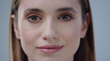 Close up young naked woman look at camera grey background care skincare female perfect studio adult attractive beautiful face girl makeup model cute pretty close up