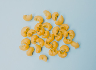 Wheat pasta isolated on a blue background. top view 