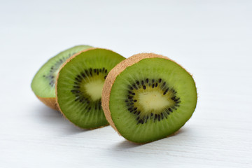  Fresh whole kiwi and half kiwi showing its texture