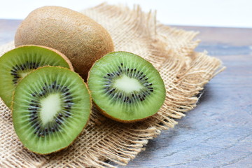  Fresh whole kiwi and half kiwi showing its texture