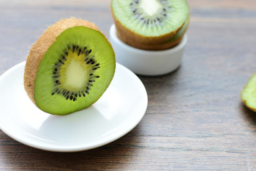  Fresh whole kiwi and half kiwi showing its texture