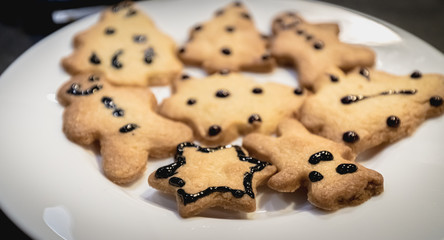 Christmas shortbread cookies in the shape of fir trees, stars and snowmen