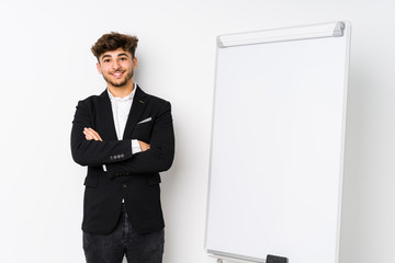 Young business coaching arabian man who feels confident, crossing arms with determination.