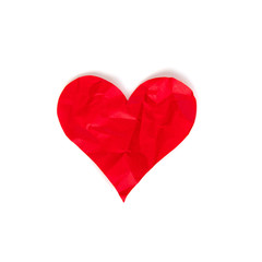 Red crumpled paper heart isolated on white background. Theme of divorce and unrequited love concept. Stock photo