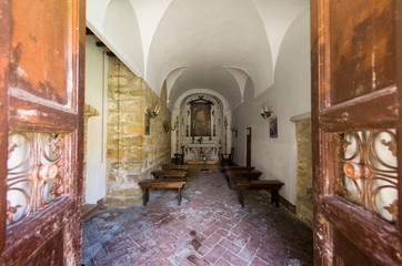 Interior view of a small and ancient church in Tuscany in Italy