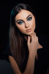 Beautiful young girl in studio. Close-up portrait. Hairstyle styling. Smooth shiny hair and skin. Lips, nails. fashion, beauty, makeup, cosmetics, beauty salon, style. Beauty and cosmetics. 