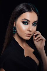 Beautiful model girl with manicure on nails. Fashion luxury makeup. Shiny eye shadow pigment. Beauty and cosmetics. Cosmetology, Beauty and Spa. Fashion model woman posing in studio. 