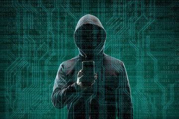 Computer hacker in mask and hoodie over abstract binary background. Obscured dark face. Data thief, internet fraud, darknet and cyber security.
