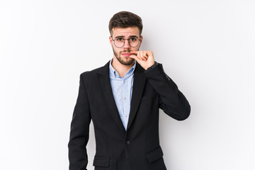 Young caucasian business man posing in a white background isolated Young caucasian business man with fingers on lips keeping a secret.