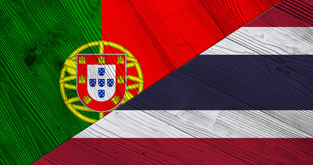 Flag of Portugal and Thailand on wooden boards