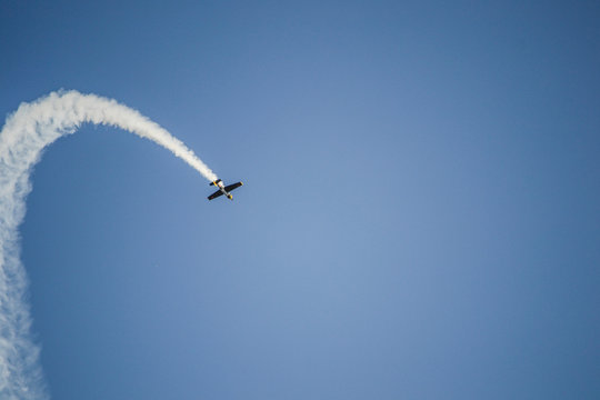 Plane Looping on the air with smoke trail