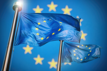 European Union flags waving in wind with EU background