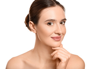 Beautiful young woman with healthy skin on white background