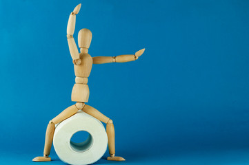 the wooden man and a roll of toilet paper, digestive problems