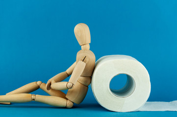 the wooden man and a roll of toilet paper, digestive problems