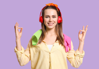 Young meditating housewife on color background