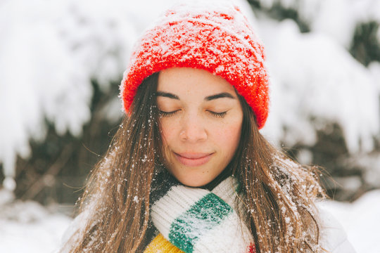 Portrait of smiling woman with eyes closed in winter