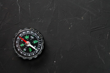 compass lies on a dark background with place for your text