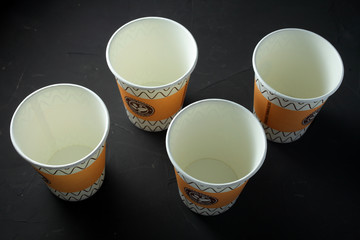 disposable glasses on a dark background