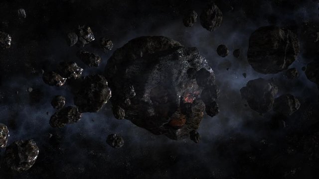 Asteroids fly in space against the background of stars