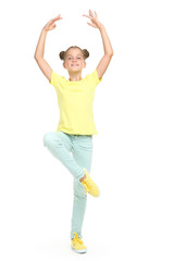 Young beautiful girl dances ballet on white background