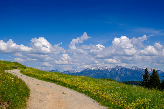 Germany, Swabia, Alpine trail in spring with clouds over Allgau Alps in background