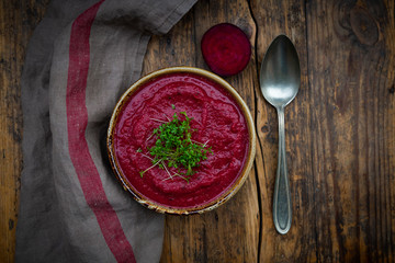 Bowl of vegan borscht with cress topping