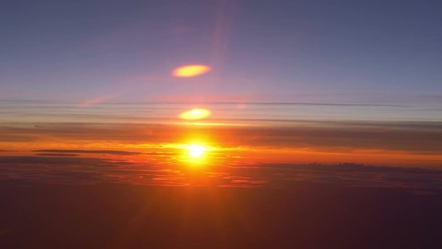 Sunset above the clouds in 4K slow motion 60fps