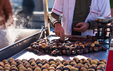 Traditional street food grilled chesnuts