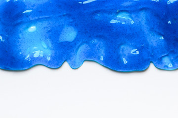 Blue sticky slime on the white surface for background