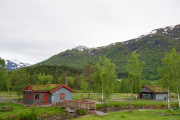 Hellesylt, service area for vehicles that allows free camping, with typical Norwegian houses with grass roofs
