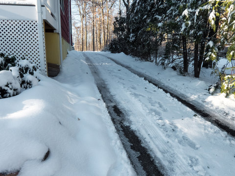 Snowy And Icy Driveway In Winter