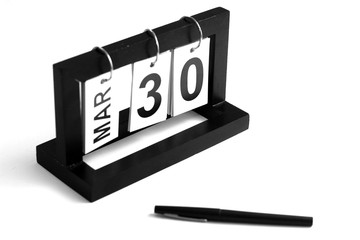 March 30th calendar icon. Day 30 of month. Office background.
