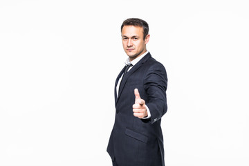 Portrait of young man pointing with his finger isolated on white background