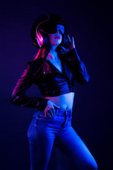 High Fashion model woman in underwear in colorful bright lights posing, portrait of a beautiful girl. Artistic colorful design. Party concept