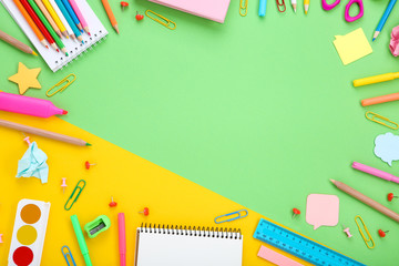 Different school supplies on colorful background