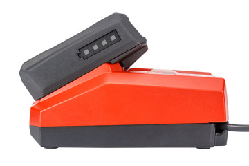 Side view of compact charger with connected 12V Li-ion battery in rubberized and glass-fiber...