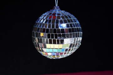 Disco ball with colored flash foils photographed in the studio