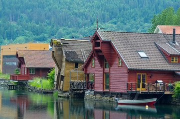 Fototapeta na wymiar Typical Norwegian wooden houses on the shores of the lake that bathes Stryn Norway