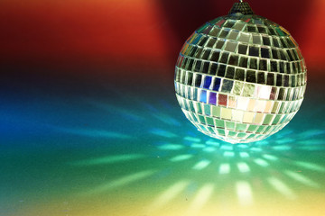 Disco ball with colored flash foils photographed in the studio