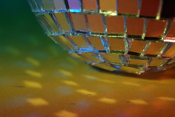Disco ball with colored flash foils photographed in the studio
