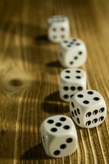 dice on an old wooden table