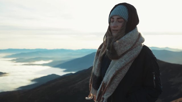 Close up view of charming european young woman tourist walking up the hill mountains relaxing enjoying the amazing view trip adventure landscape outdoor pure nature slow motion close up