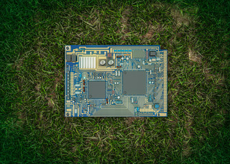 green IT generic circuit board on grasss background no id 3d render