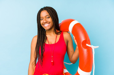 Young african american life guard woman isolated happy, smiling and cheerful.