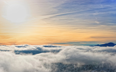 Sun and clouds on the top of Kasprowy Wierch of Zakopane in winter. Zakopane is a town in Poland in Tatra Mountains. Kasprowy Wierch is a mountain in Zakopane and the most popular ski area in Poland