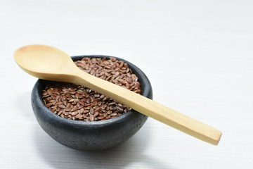  natural flaxseed seeds displayed in containers