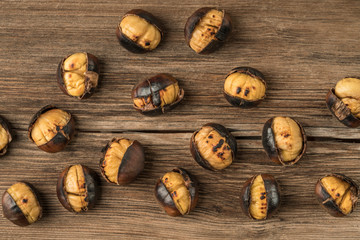 roasted chestnuts on a wooden table